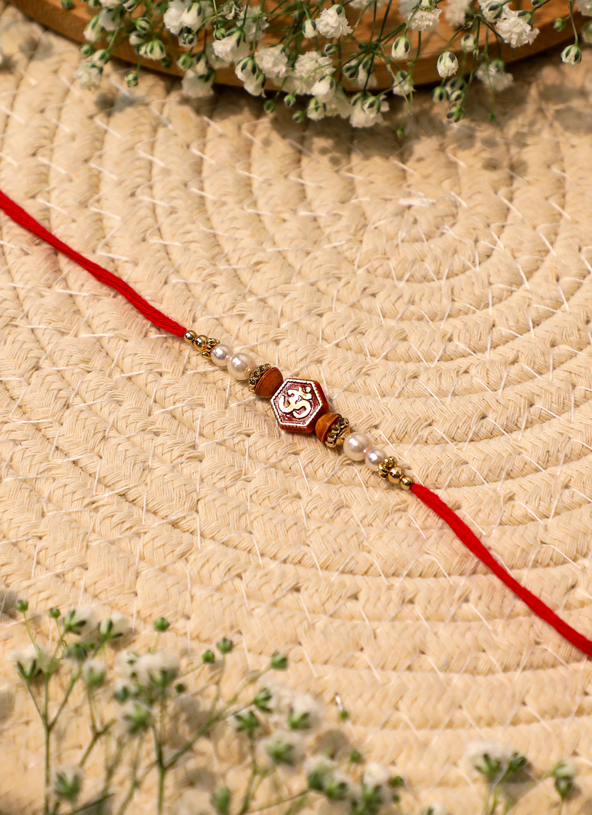 Madhoor Om Rakhi Red Ivory 1 Piece