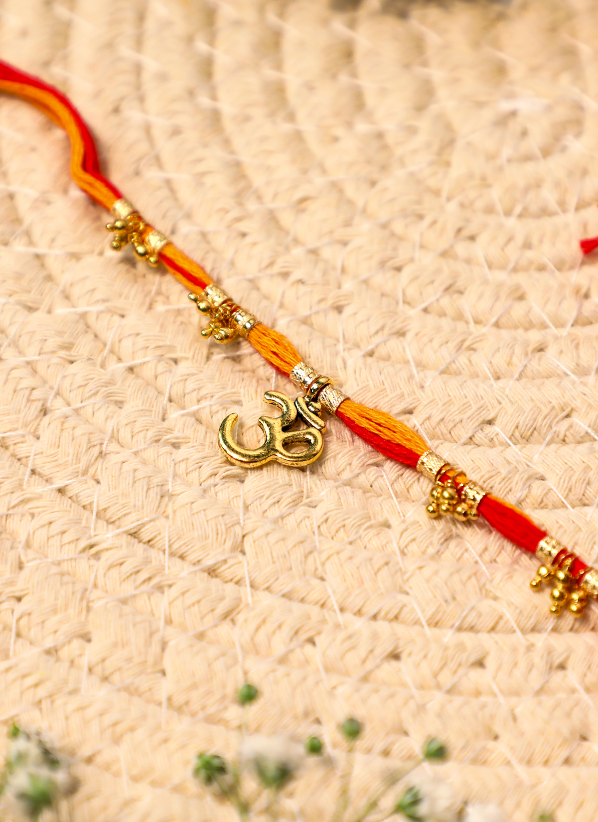 Madhoor Om Rakhi Red Yellow 1 Piece