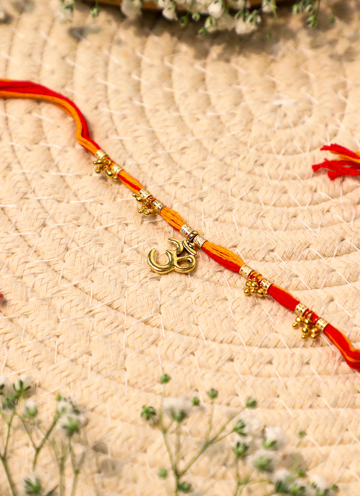 Madhoor Om Rakhi Red Yellow 1 Piece