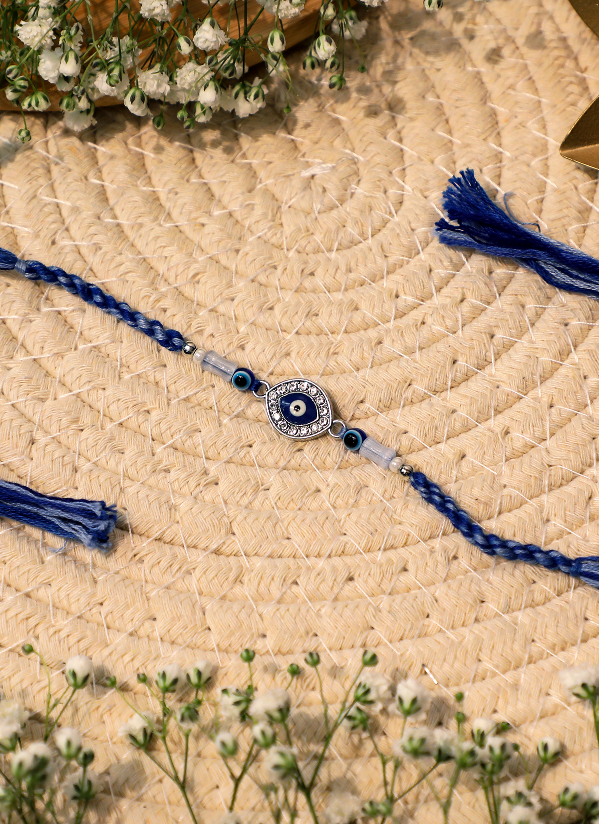 Madhoor Evil Eye Rakhi White Blue 1 Piece