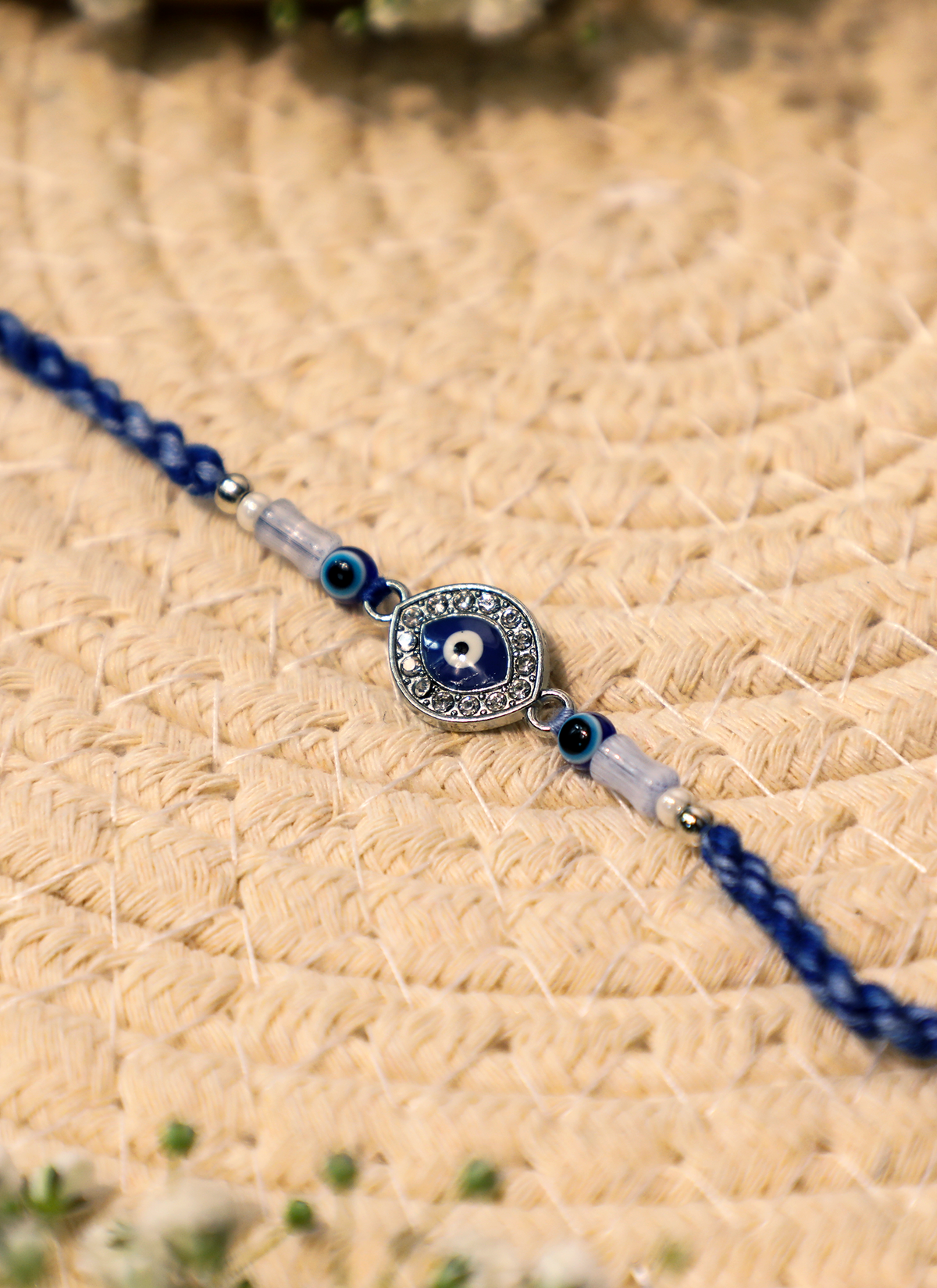 Madhoor Evil Eye Rakhi White Blue 1 Piece