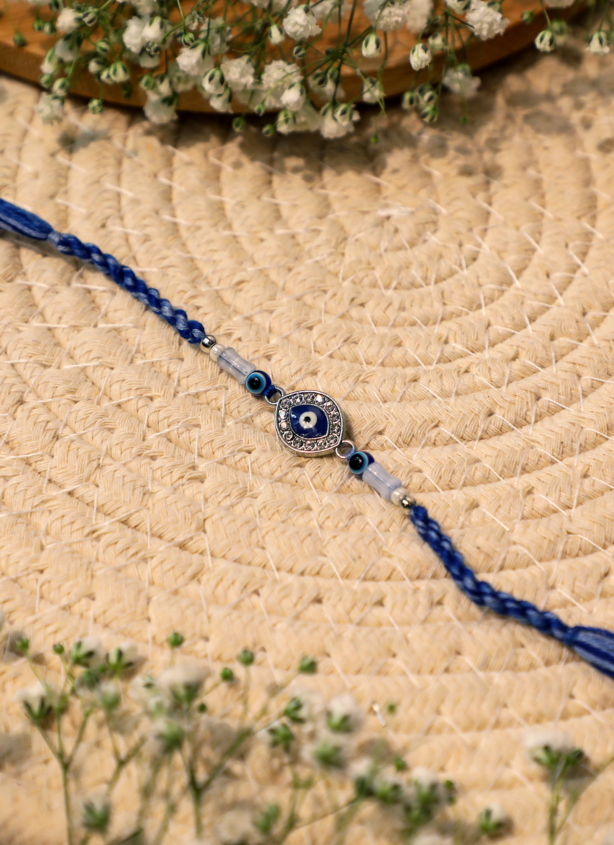 Madhoor Evil Eye Rakhi White Blue 1 Piece