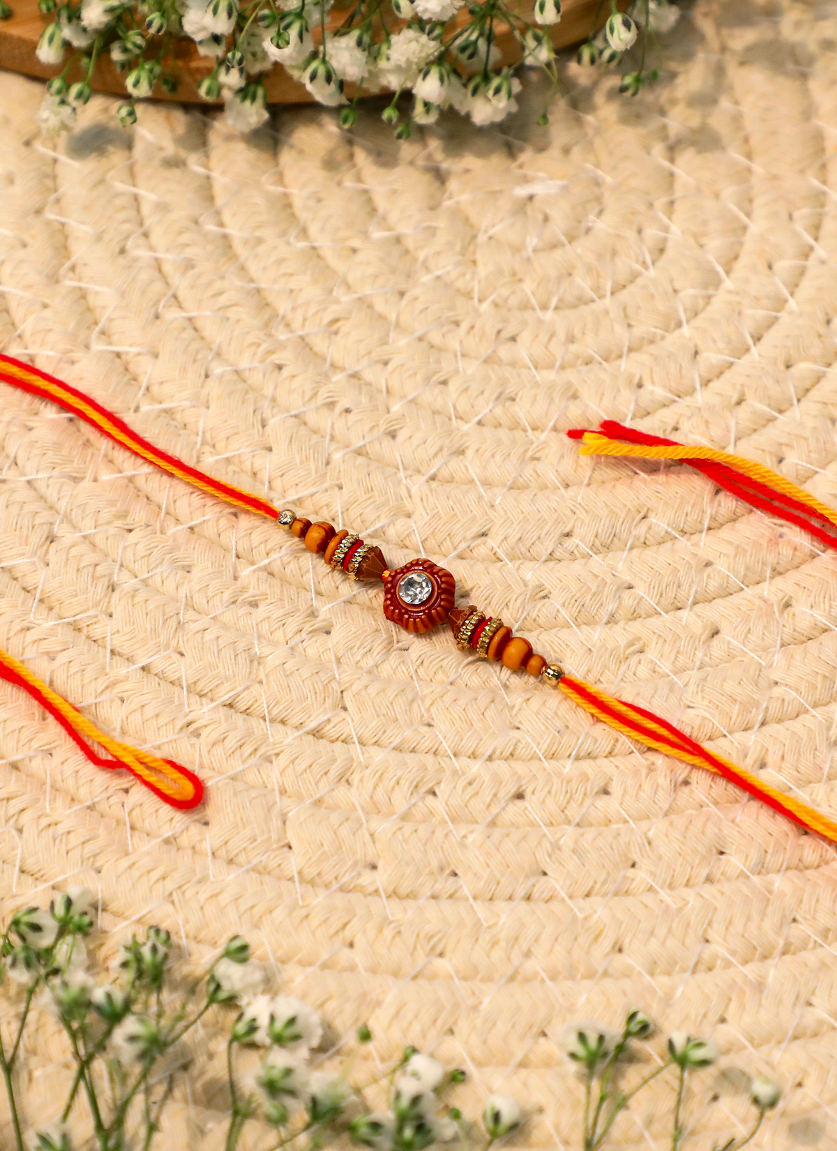 Madhoor Swastik Rakhi Red Yellow 1 Piece