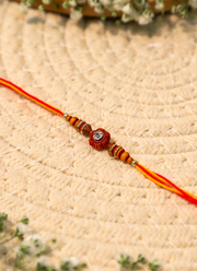 Madhoor Swastik Rakhi Red Yellow 1 Piece
