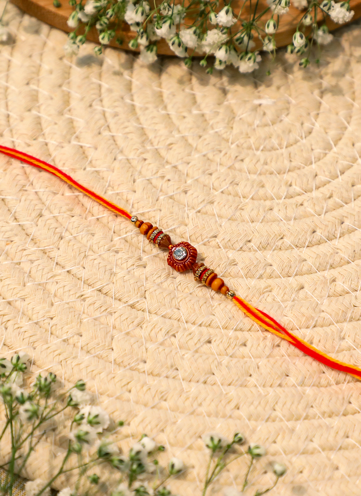 Madhoor Swastik Rakhi Red Yellow 1 Piece