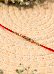 Madhoor Bead Rakhi Cream Red 1 Piece