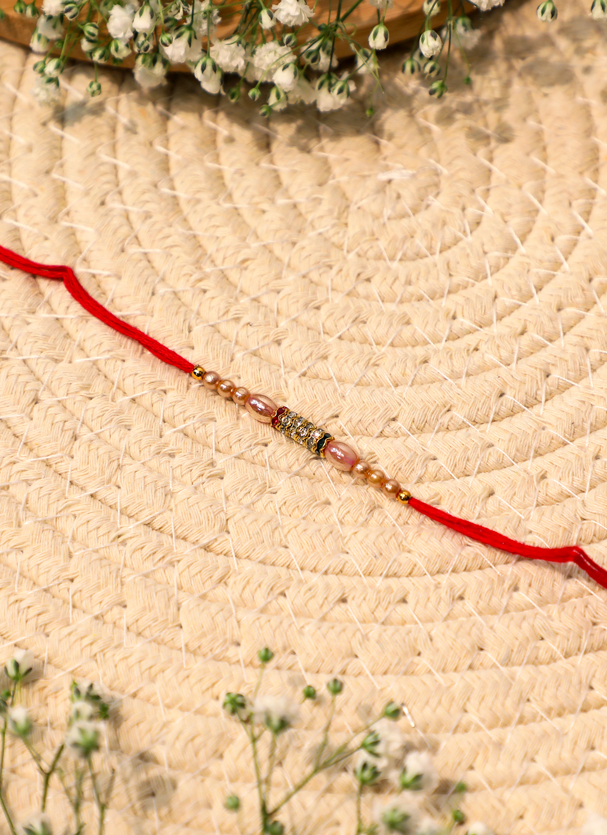 Madhoor Bead Rakhi Cream Red 1 Piece