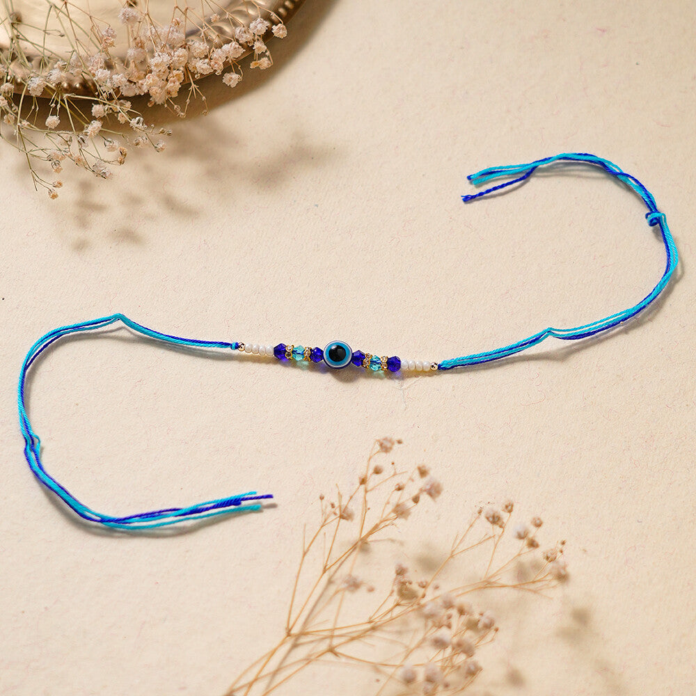 Madhoor Evil Eye Crystal Rakhi Blue White 1 Piece