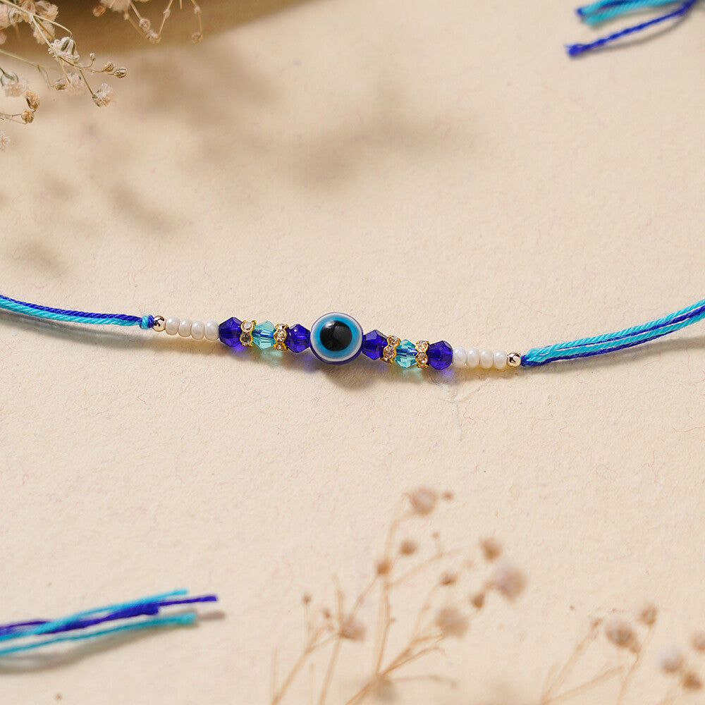 Madhoor Evil Eye Crystal Rakhi Blue White 1 Piece