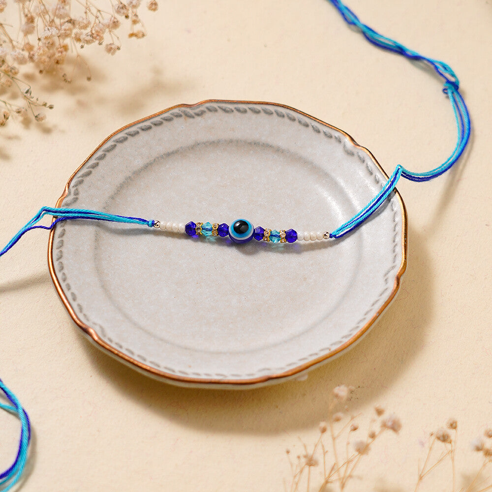 Madhoor Evil Eye Crystal Rakhi Blue White 1 Piece
