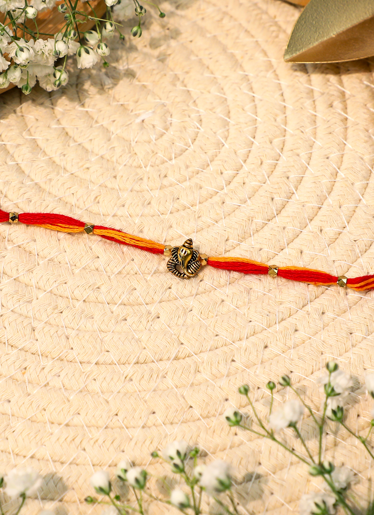 Madhoor Ganesha Rakhi Red Yellow 1 Piece