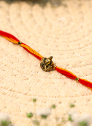 Madhoor Ganesha Rakhi Red Yellow 1 Piece