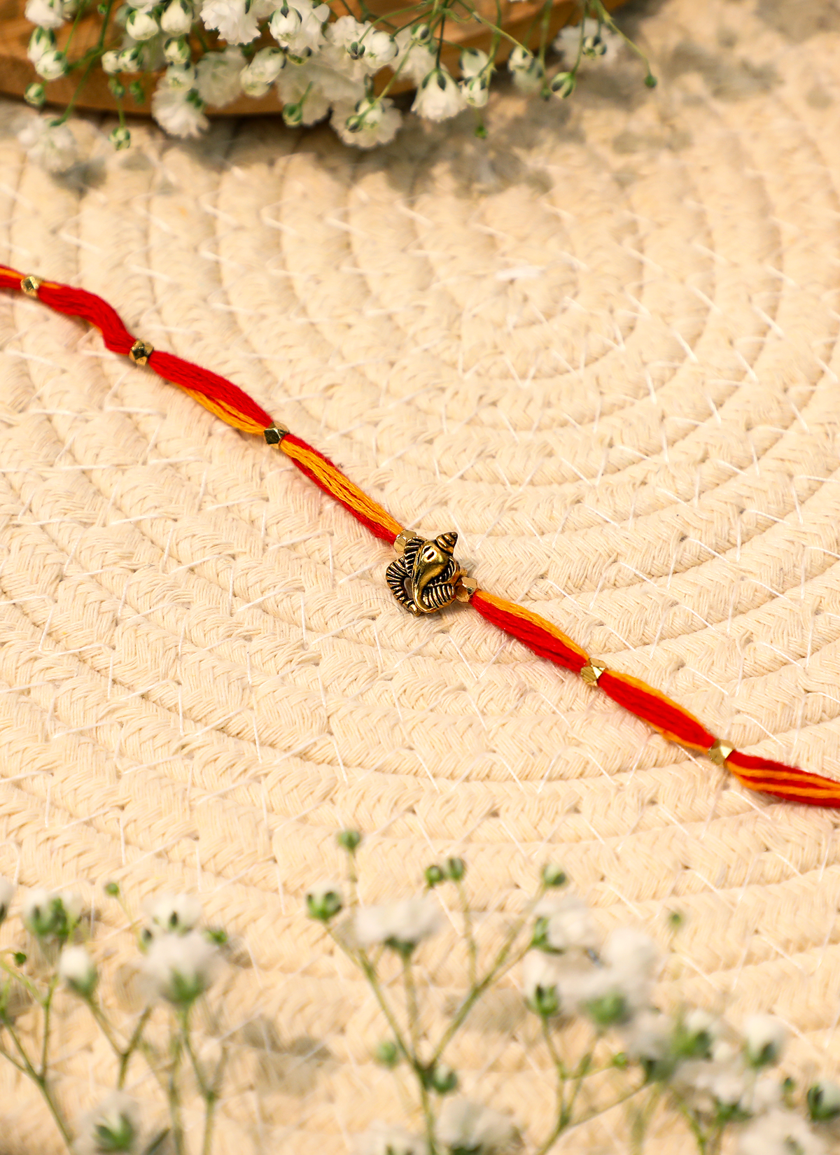 Madhoor Ganesha Rakhi Red Yellow 1 Piece