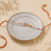 Madhoor Crystal Rakhi Brown White 1 Piece