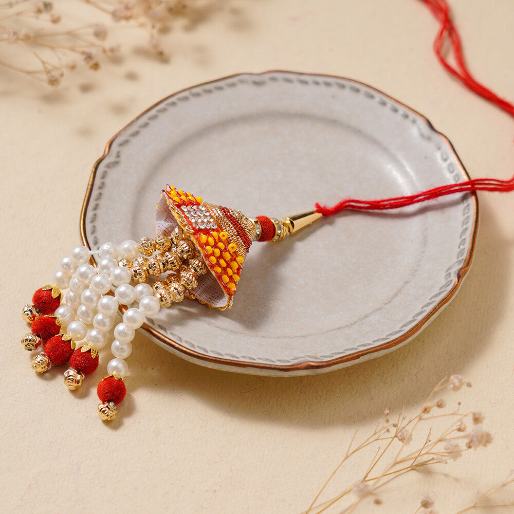 Madhoor Bead Jhumka Lumba Rakhi Peach 1 Piece